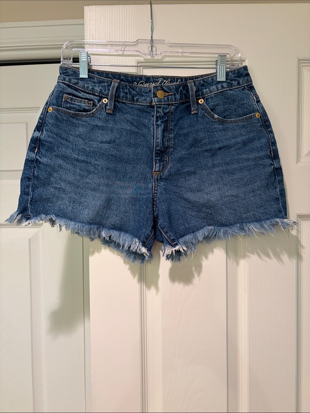 Universal Thread Denim Cutoff Shorts in Medium Blue with Frayed Hem